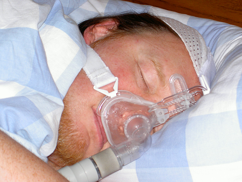 wearing a sleep apnea mask